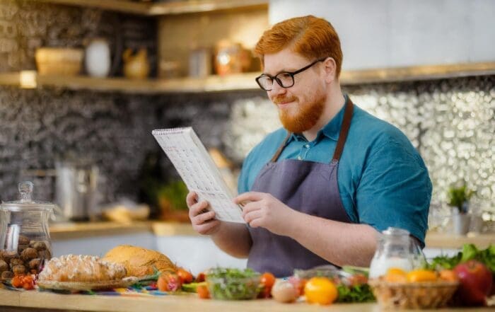 Chef reviewing a recipe for diet progression after bariatric surgery